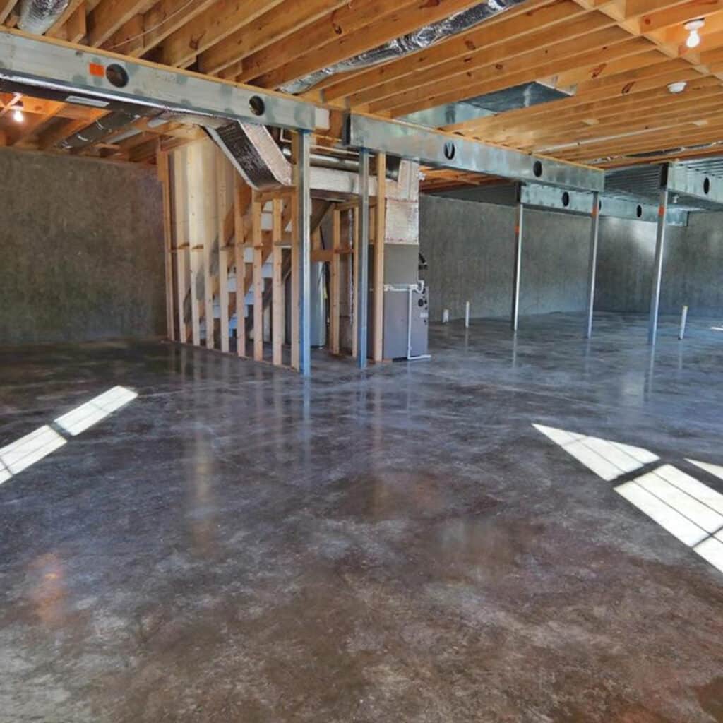 Image of a basement with framing using the Metwood TUFF BEAM™ Structural CFS Beam to allow wide open space.